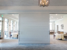 Union League Golf Club renovation- oversized, room-dividing barn doors that slide with one hand