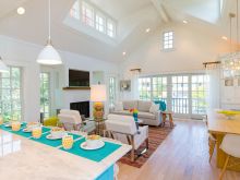 bright white wood open plan home with tropical coloful accents