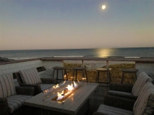 rooftop oceanview dining and lounge area with built in fire pit Stone Harbor NJ