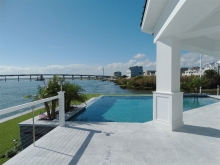 infinity pool with stone and  shaded area overlooking bay Avalon Manor NJ